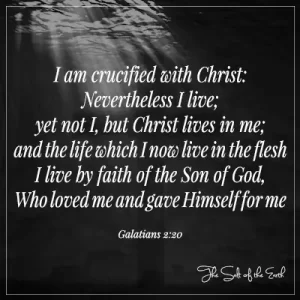 black image water and cross with bible verse galatians 2-20 i am crucified with christ nevertheless I live yet not I but christ lives in me